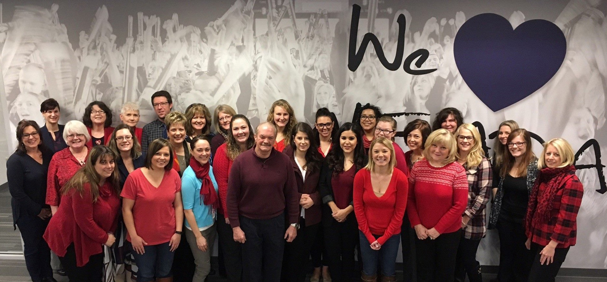 Immunize team of partners dressed in red